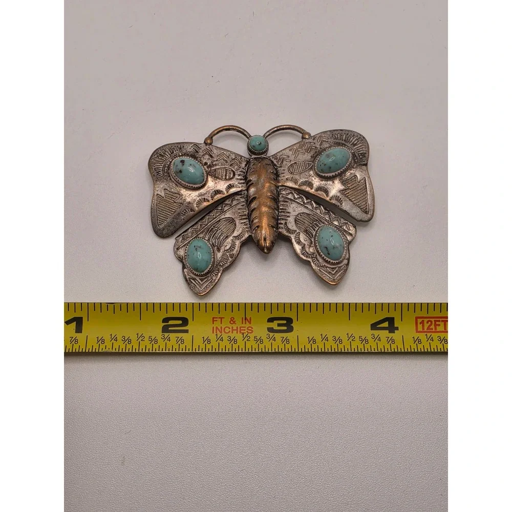 Undefined butterfly brooch